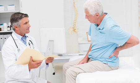 Doctor exams spine for severity of degenerative disc disease